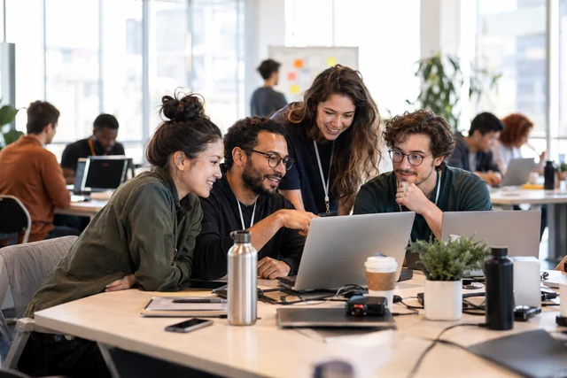 Teams collaborate on technology projects at a hackathon.
